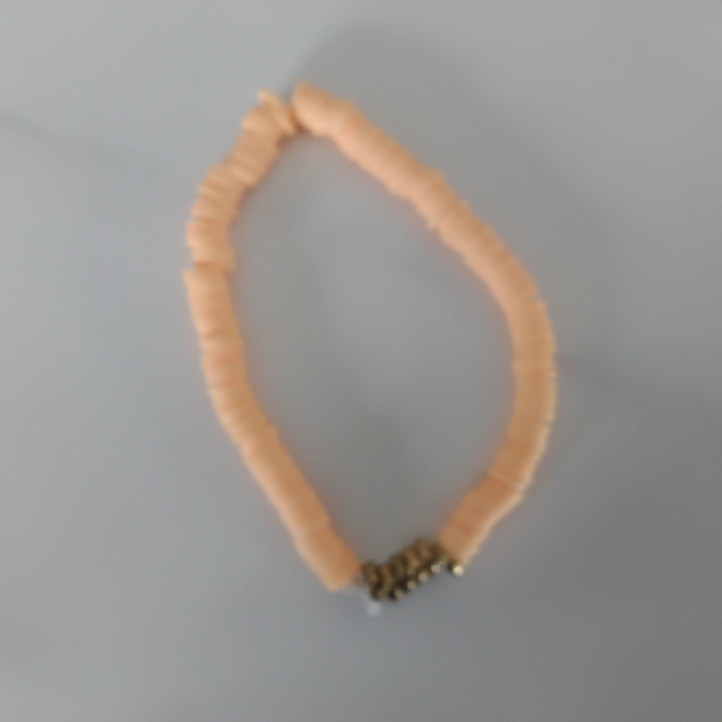 Orange with gold clay bead bracelet