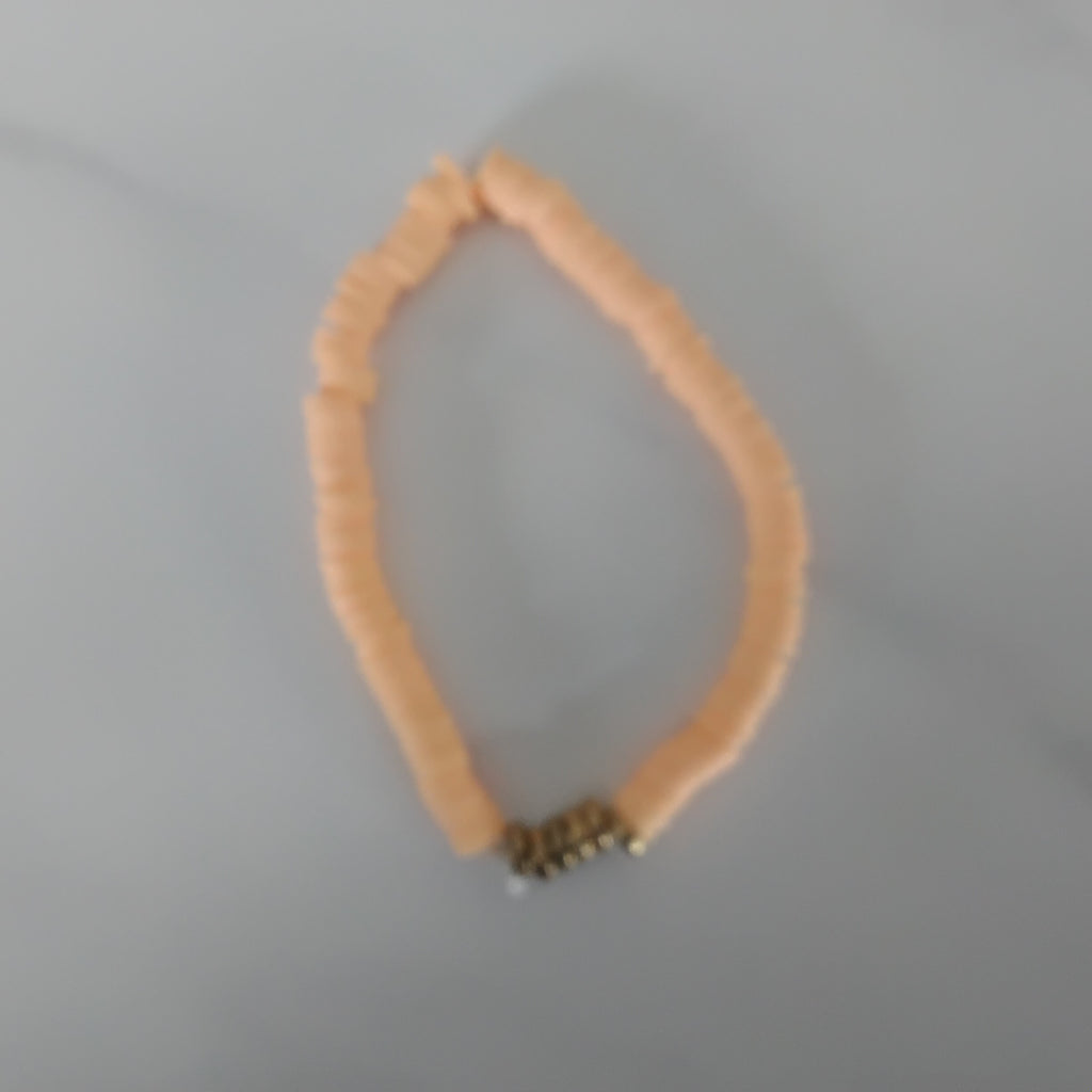 Orange with gold clay bead bracelet