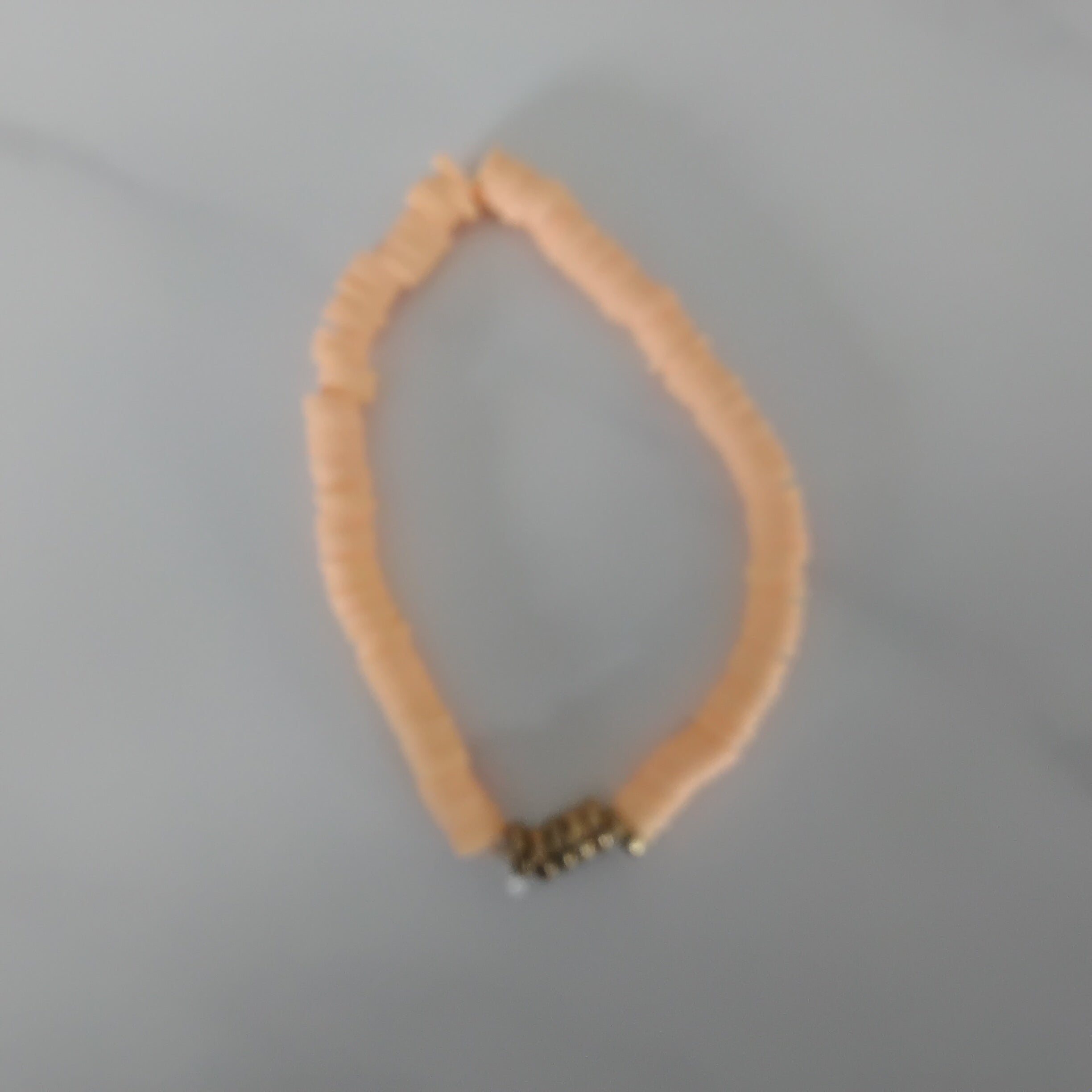 Orange with gold clay bead bracelet